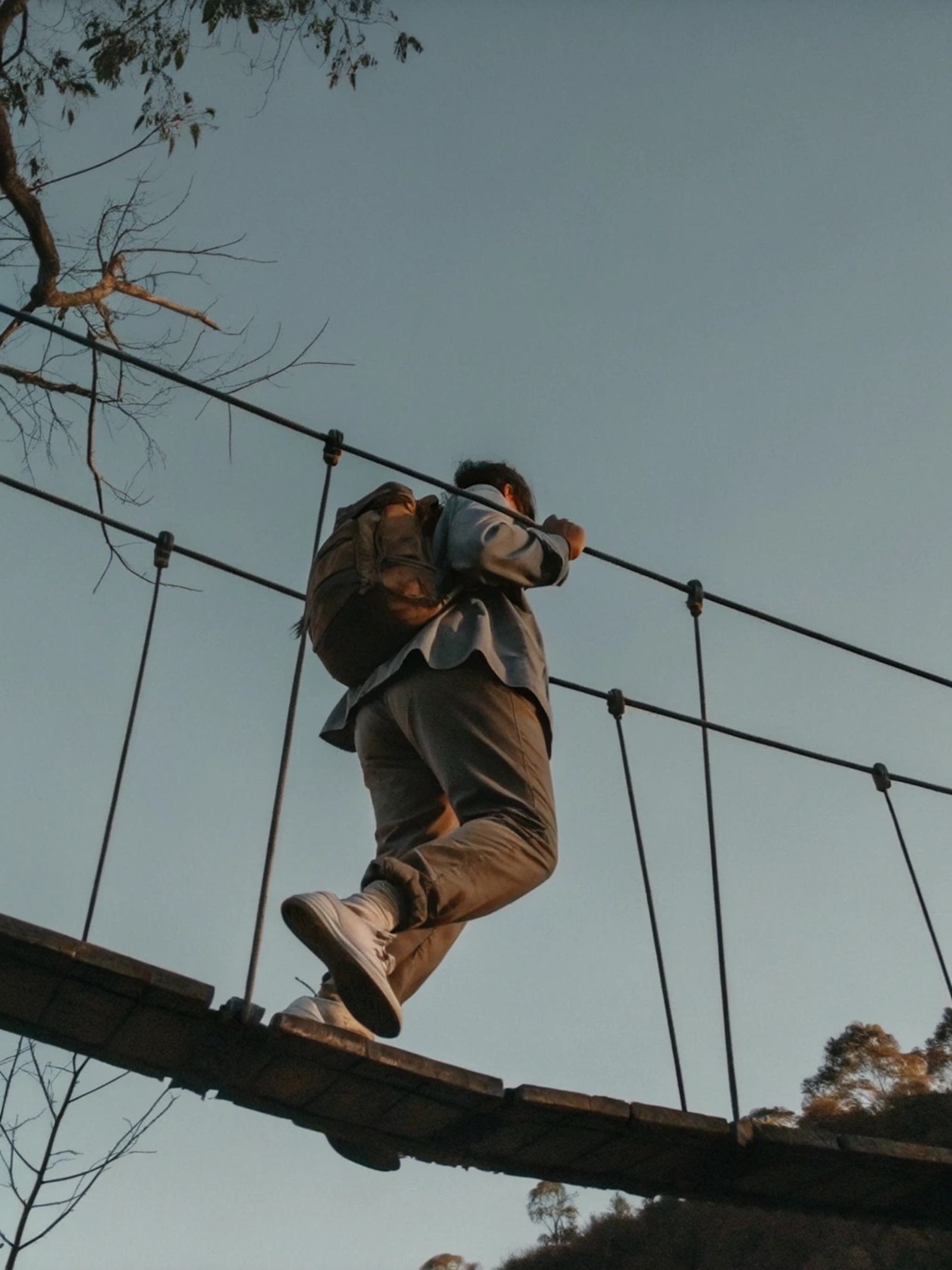 Walker on a suspension bridge